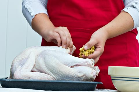 Stuffing a large turkey for a holiday dinner
