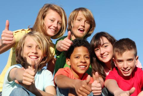 Group of happy youth at summer camp
