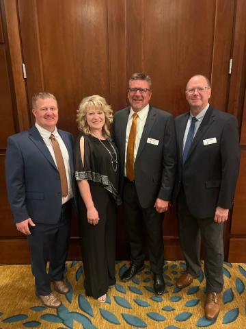 Left to right: Scott Fitzke, LandMark Implement Region Sales Manager; Tiffany Tritten, John Deere Division Business Manager; Troy Lorenzen, LandMark Implement Corporate Sales Manager; Mike Kongs, LandMark Implement Corporate Asset Manager